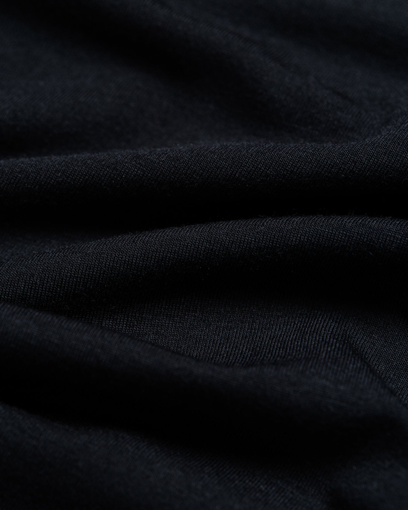 Outnback Bog Tee black fabric texture close-up