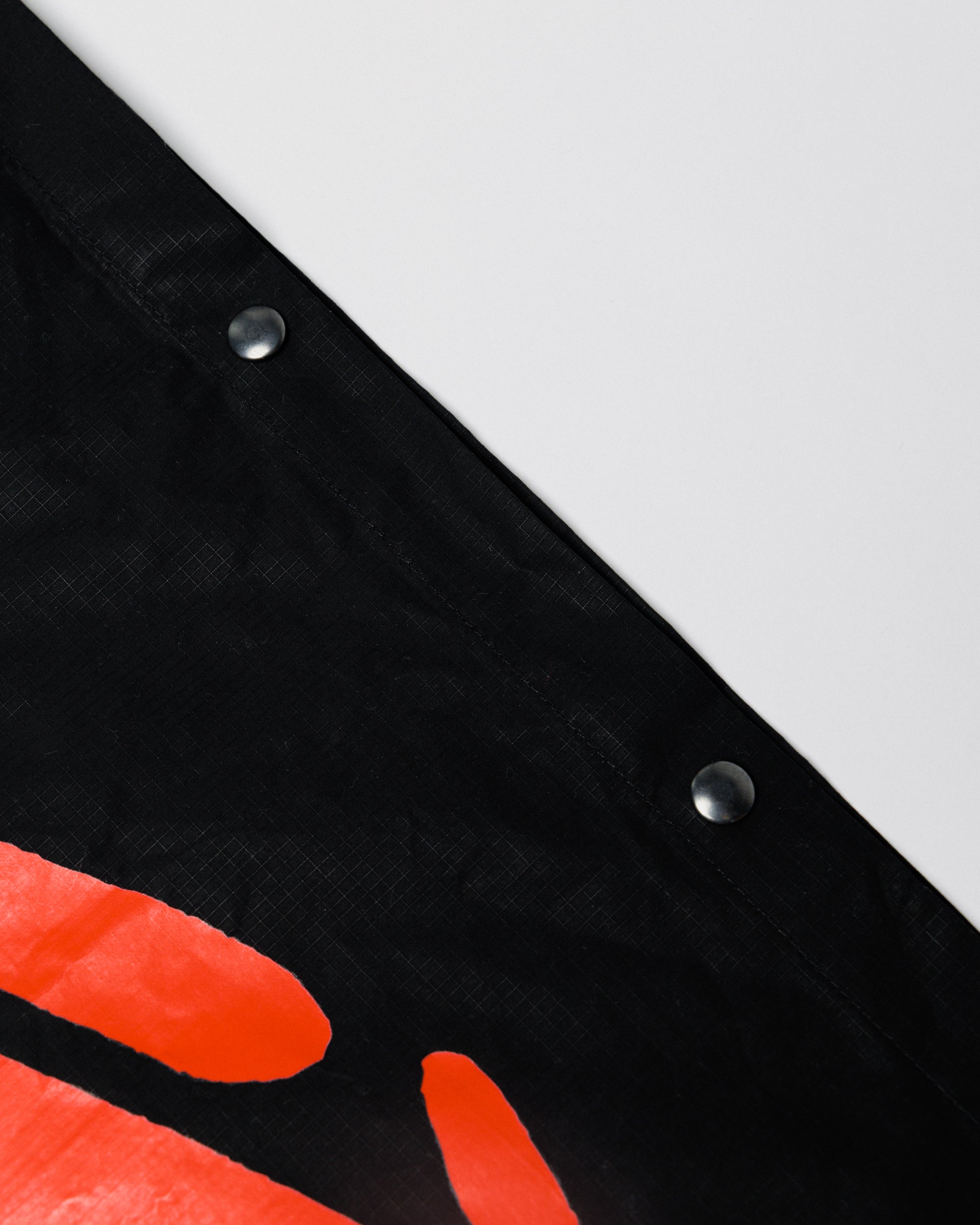 Outnback Musette in black, press-stud snap detail