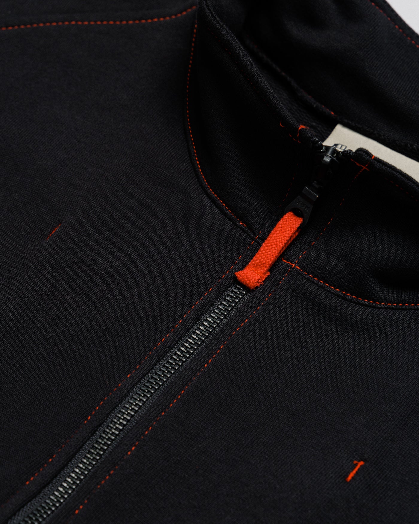 Outnback Recovery Cape in black, front zip and funnel collar detail