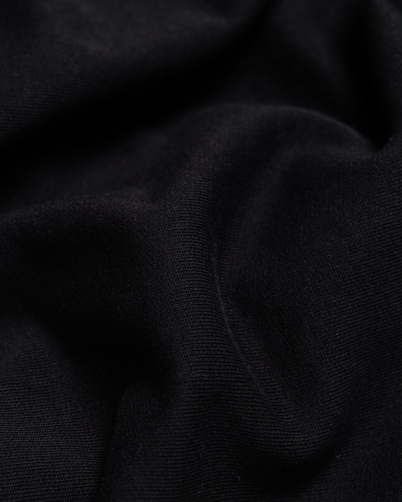 Outnback Recovery Cape in black, fabric detail