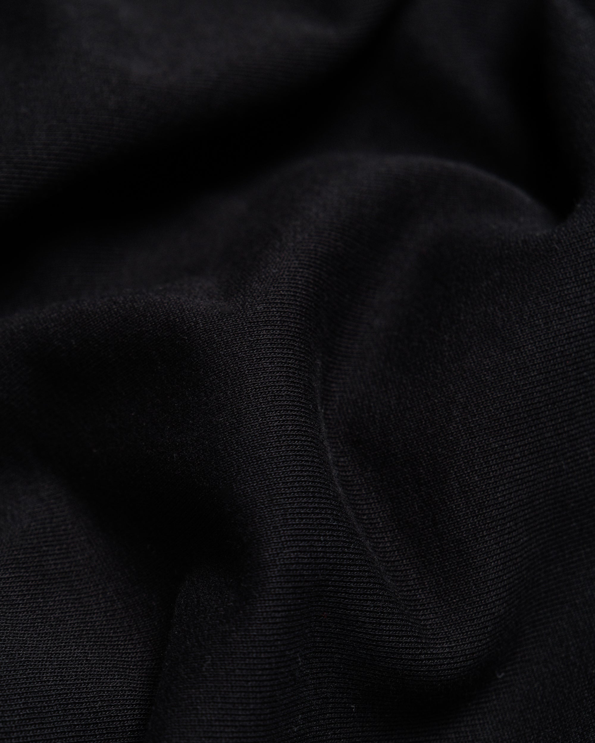 Outnback Recovery Cape in black, fabric detail