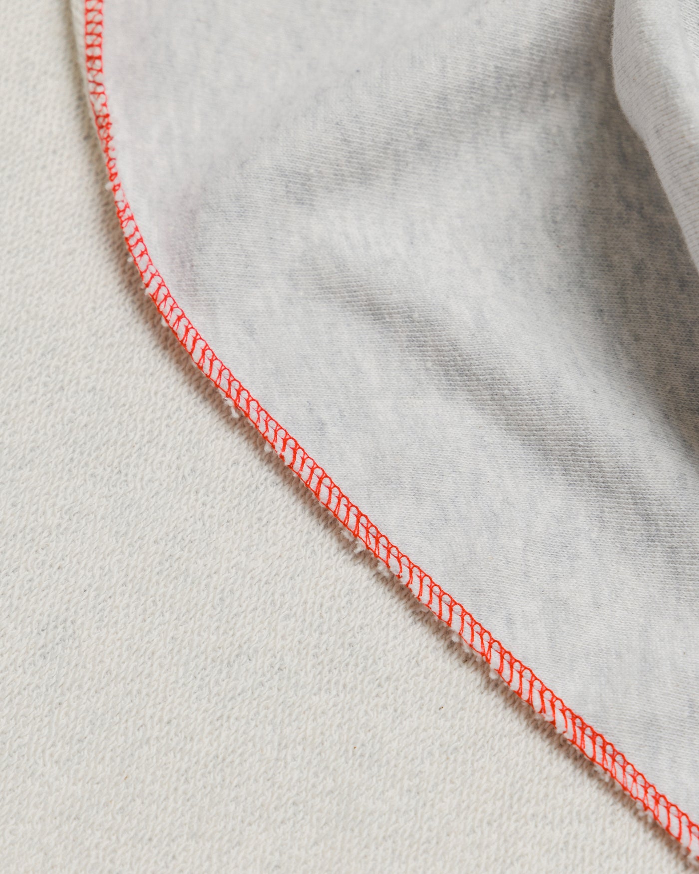 Outnback Recovery Cape in marl grey, contrast red overlock edge stitching detail