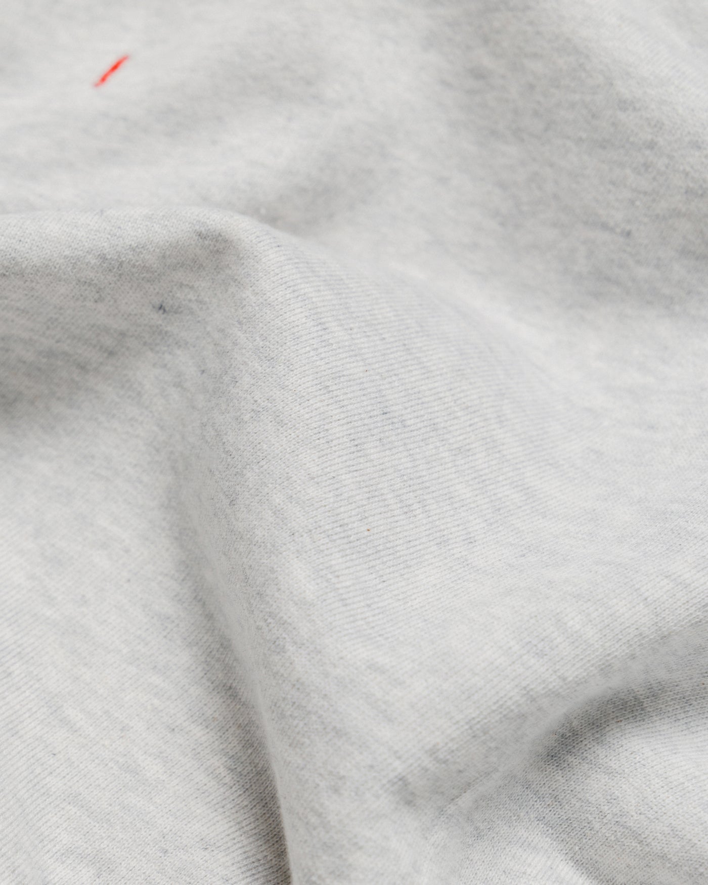 Outnback Recovery Cape in marl grey, fabric face texture detail