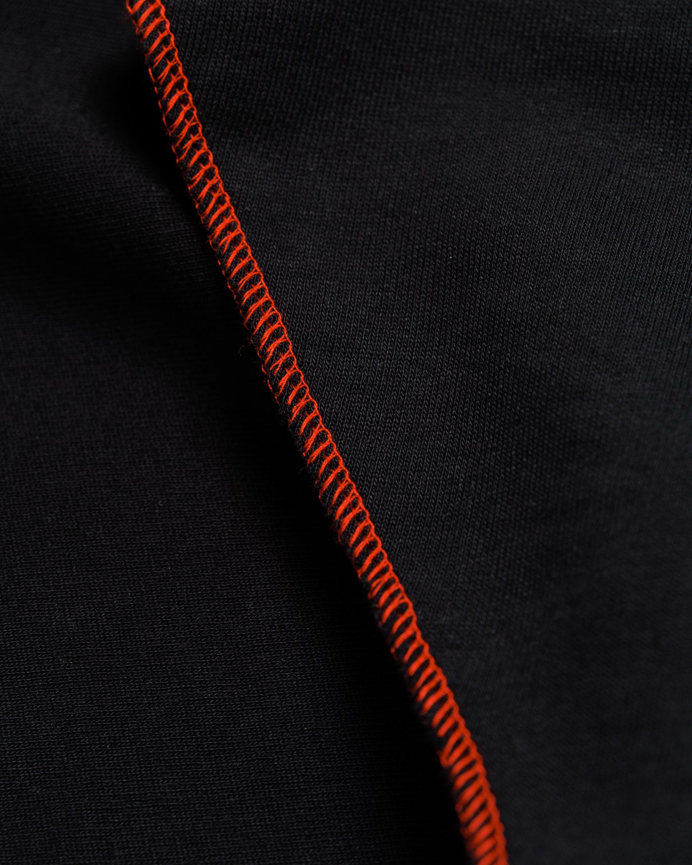 Outnback Running Short in black, contrast orange stitching detail