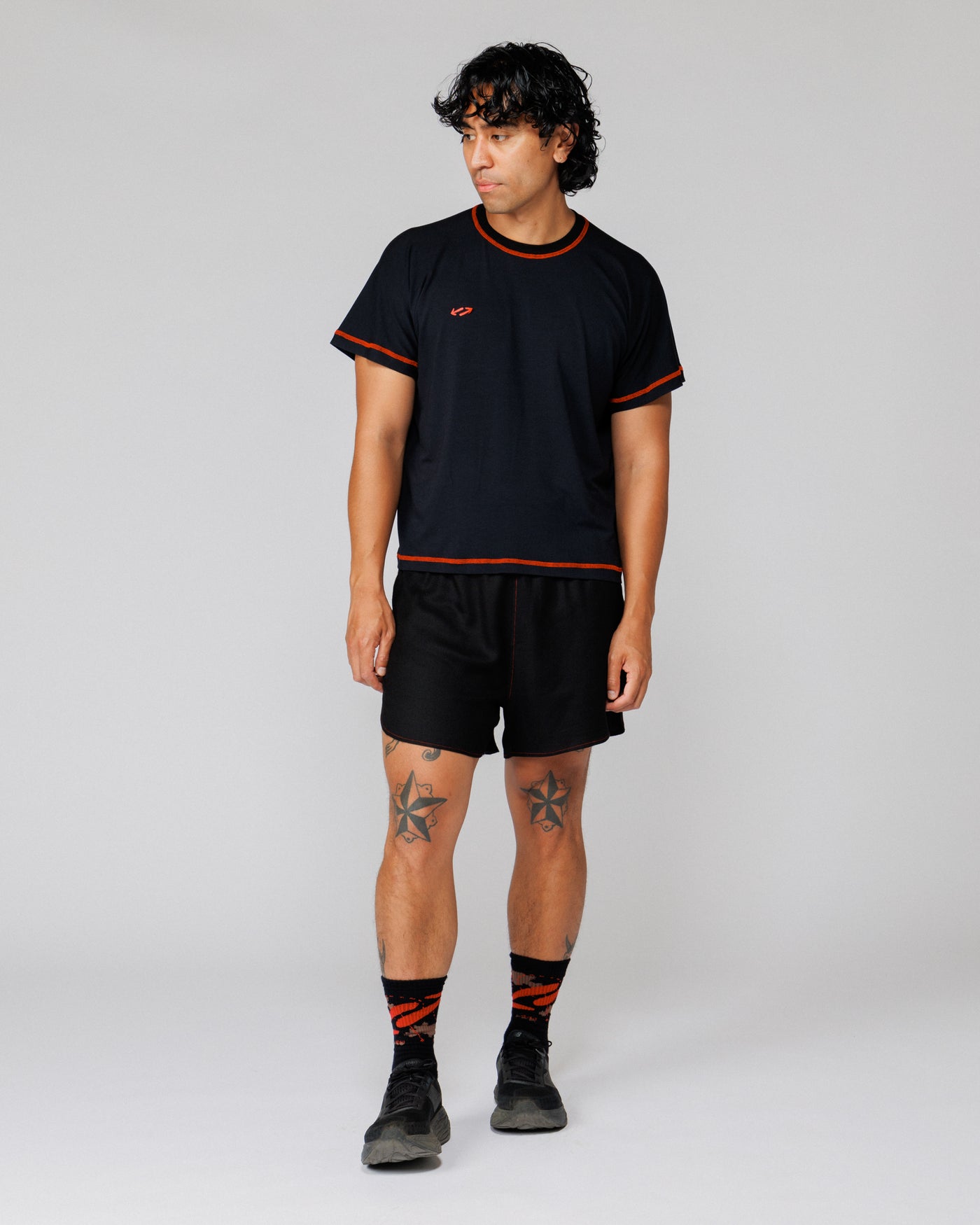 Outnback Running Short in black, relaxed front view on model