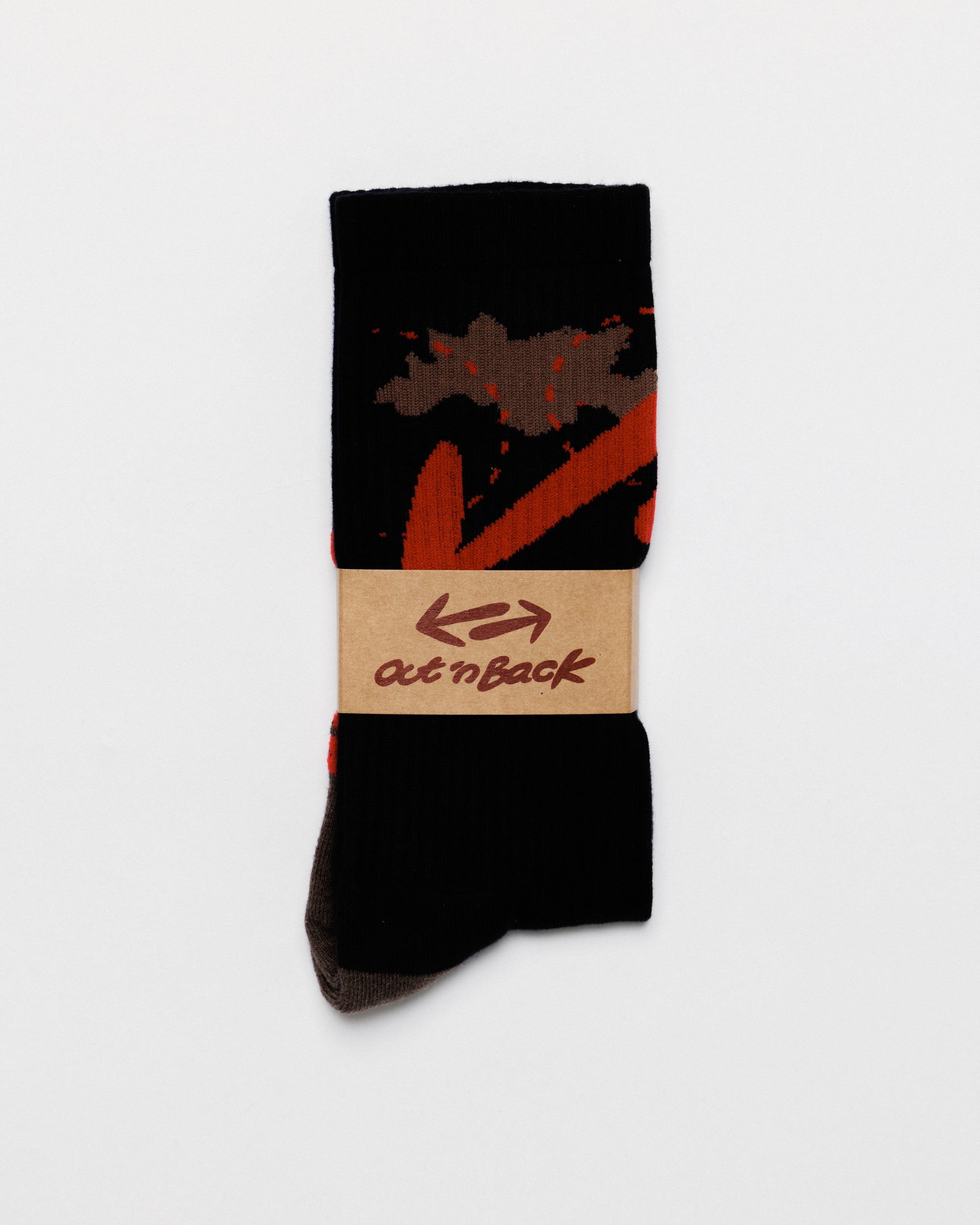Outnback Running Socks in black and red, folded with out'n back paper band
