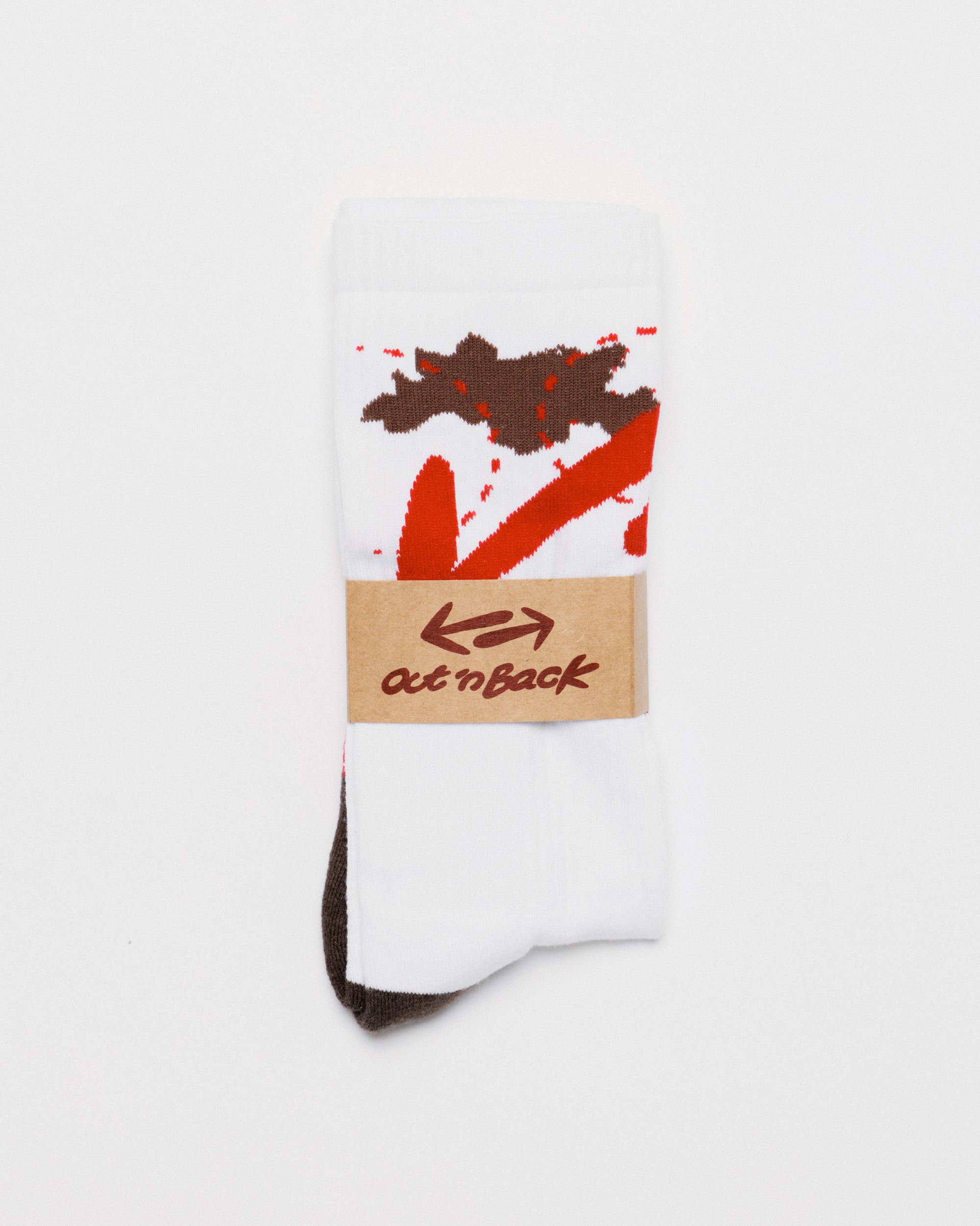Outnback Running Socks in white and red, packaging band detail